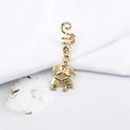 Detailed macro view of a vintage gold alloy spiral hair ring with cartoon lovers charm - Kissing Couple Style (M4505-28#)