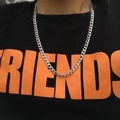 Unisex silver stainless steel curb chain necklace worn over a black and orange graphic tee - Curb Chain / 7mm Width 60cm Length