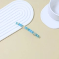 Blue and beige textured acetate hair clip with metal spring base for ponytail - Metallic Blue