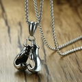 Macro detail of silver boxing glove pendant with realistic texture and metallic shine - Boxing Glove Design / Silver