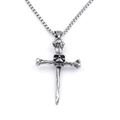 Macro detail of punk skull cross pendant with vintage oxidized finish on steel chain - Skull Bone Cross Style