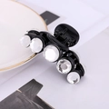 Detail of a black acrylic hair claw clip decorated with five sparkling white crystals - Black With White (E6304)