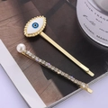 Golden hair clip set with blue evil eye design, sparkling rhinestones and white pearl - Evil Eye Rhinestone Pearl Hair Clip (D5103)