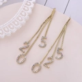 Eleganti orecchini a nappa lunga dorati con ciondoli numerici 520 e strass scintillanti - Oro (A9309)