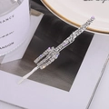 Elegant silver hair clip with sparkling rhinestones on a fashion magazine background - Fork Design(C6316)