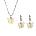 Detailed macro view of vintage resin butterfly necklace and hoop earrings jewelry set - Yellow Butterfly Style (J5307)