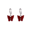 Fashionable red acrylic butterfly drop earrings with silver hoops on white background - Red