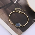 Detail of gold hexagon crystal bracelet featuring blue resin stone and adjustable clasp - Deep Blue Gold Base