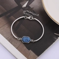 Detail view of silver bracelet with hexagonal blue crystal and adjustable lobster clasp - Blue Silver Backing