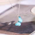 Detail of blue gradient butterfly pendant with gold-edged wings and silver chain - Necklace (D3111) / Sky Blue