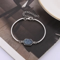 Detailed close-up of a silver-toned bracelet featuring a hexagonal deep blue resin stone - Dark Blue Silver Base