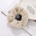 Close-up of soft beige faux shearling hair scrunchie with plush curly wool texture - Beige (N2405)