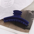 Large dark blue flocked crescent hair claw clip for women on a minimalist background - Blue