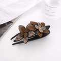 Elegante fermaglio per capelli in resina nera con fiori di strass ambra e oro scintillanti - Champagne + Caffè