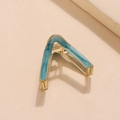 Detail of blue marble finish on golden V-shaped metal hair clip with a sturdy spring - Sky Blue (E5120)