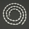 Detail of a 6mm silver-tone tennis chain with flower links and sparkling cubic zirconia stones - 18cm / Silver