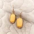 Geometric yellow marble resin drop earrings with gold-finished hexagon frames - Earthy Yellow