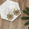Bohemian vintage hollow gold mandala earrings displayed on a white marble tray - Mandala Octagonal Star (A9130) / Antique Gold
