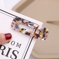 Detail of marble pattern acetate hair clip with golden metal clip on white card - Marble Multi