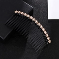 Detail of amber rhinestone flower pattern on a black plastic anti-slip hair comb - Champagne Hair Comb