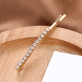 Elegante fermaglio per capelli in metallo dorato con cristalli su vassoio - Diritto (B6133) / Oro