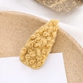 Close-up of ginger yellow faux lamb wool hair clip on a cozy wooden tray setting - Yellow (E6201)