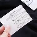Minimalist 4-piece silver metal hair clip set with wavy and geometric shapes on card - Silver Style (c5209)