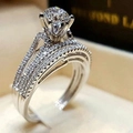 Macro shot of a classic six-prong diamond ring with a triple-band micro-pave design - Six-Claw Round Multilayer Style (r4983)