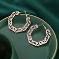 Detail of rose gold octagonal earrings with hollow scroll patterns on ceramic plate - Rhombus Shape Rose Gold (C9507)