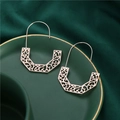 Rose gold geometric hollow earrings with intricate patterns on a dark green tray - Semi-Rhombus Shape Rose Gold (A8534)