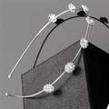Detailed view of silver hairband featuring six sparkling crystal floral arrangements - Silver White Rhinestone Style (I5209)