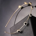 Detail of gold metal headband with black gemstones and clear crystals on black leather - Gold Black Rhinestone Style (I5209)