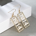 Dettaglio orecchini dorati 1314 con strass bianchi su scatola porta gioielli - 1314 Oro + Bianco