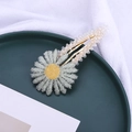 Detailed macro view of a daisy hair clip with clear beads and gold metal base - Green (C2533)