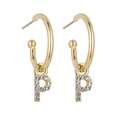 Detail of gold letter P earrings with sparkling rhinestones on a clean white background - B1225 Gold P
