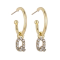 Detail view of gold letter Q pendant earrings featuring micro-pave cubic zirconia crystals - B1226 Gold Q