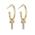 Detailed view of gold hoop earrings with sparkling crystal-encrusted letter T pendants - B1229 Gold T