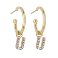 Close-up of gold letter U drop earrings featuring sparkling micro-pave cubic zirconia - B1230 Gold U