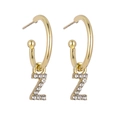 Close-up of gold hoop earrings with sparkling crystal-encrusted letter Z pendants - Gold Z-b1321