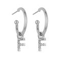 Macro view of silver alphabet F earring with shimmering cubic zirconia stones - Silver F