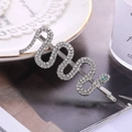 Zilveren slangenhaarspeld met witte strass steentjes en groen kristallen oog - Zilver (C1202) / Zilver