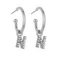 Close-up of silver letter N hoop earrings with pavé set shimmering cubic zirconia - Silver N