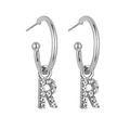 Macro detail of silver C-hoop earrings featuring crystal-paved letter R charms with studs - B1227 Silver R