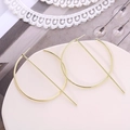 Minimalist gold geometric hoop earrings with vertical metal bar on ceramic tray - Gold