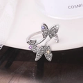 Macro shot of silver butterfly ring with multi-color rhinestones and sparkling crystals - Silver D8412