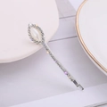 Elegant silver hair clip with pearls and sparkling crystals on a white ceramic plate - Marquise Style (C3525)