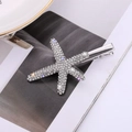 Close-up of a silver starfish hair clip with sparkling blue and purple rhinestones - White Diamond Silver Style (C4314)
