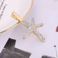 Detailed close-up of a starfish hair clip with rainbow rhinestones on a ceramic plate - AB Rhinestone Gold Style (H2311)