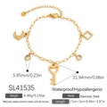 Gold stainless steel bracelet featuring moon, star, and heart key charms with zircon stones - Star Moon Key Multi-Pendant Style (SL41535)