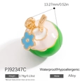 Macro detail of a tropical coconut alloy charm with green oil drip and blue flower - Sky Blue Flower Coconut Style (PJ92347C)